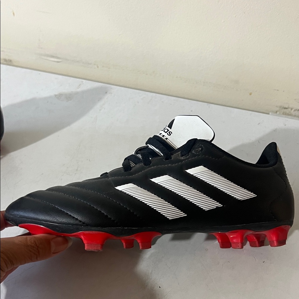Adidas Kids Black and White Cleats with Red Soles